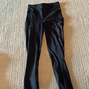 Black Lululemon leggings with mesh cut out